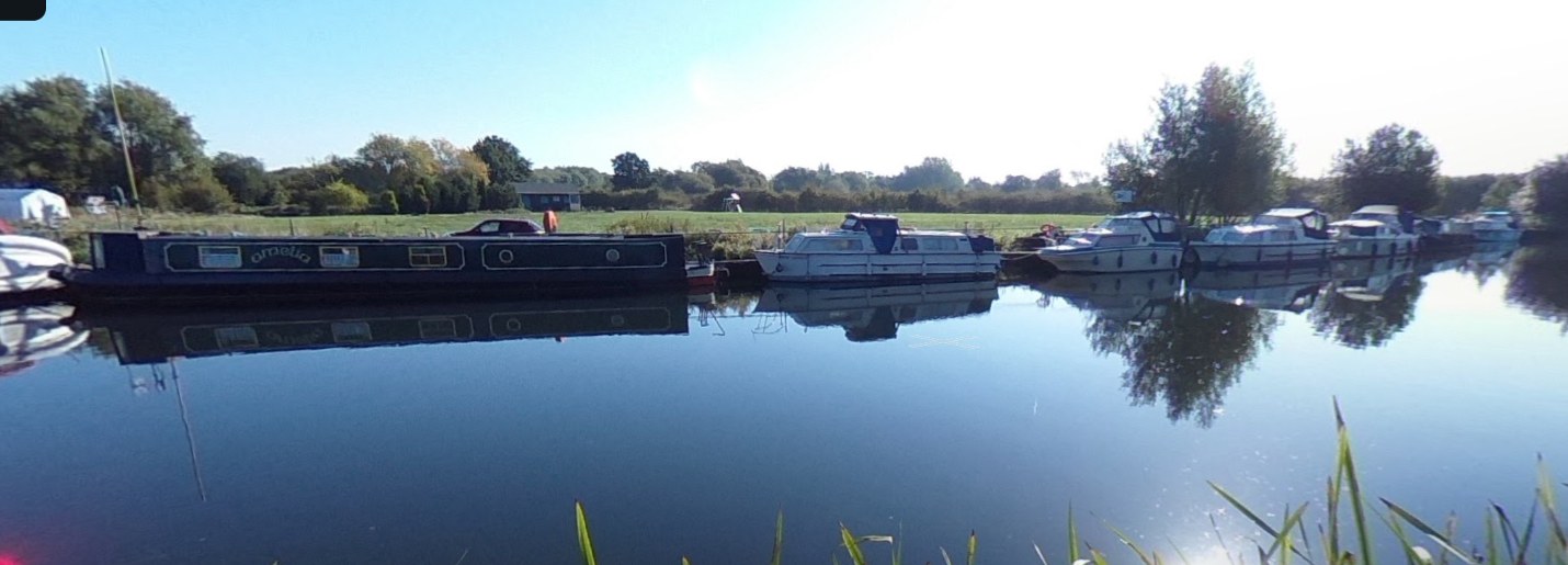 Boats moored on the river at Broxbourne Cruising Club