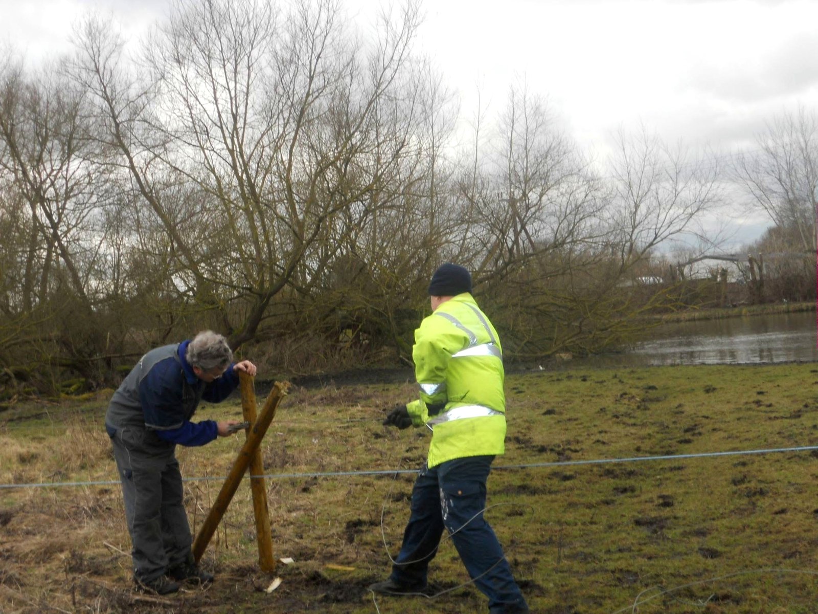 Members carrying out work near the river