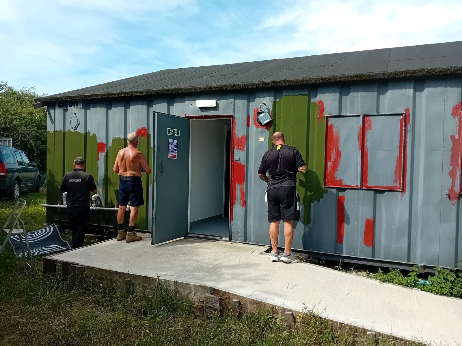 Members preparing the clubhouse exterior during the 2025 to 2026 refurbishment